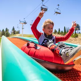 Hands raised high as your glide down the summer tube lanes at Snow Summit.