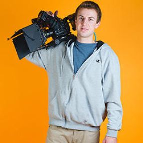 Filmmaker Andrew Celmins holds his favorite tool for film.