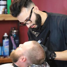 Looking to get a clean cut and shave? Book an appointment with us today!