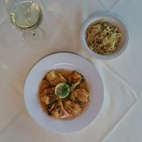 Nino's Italian Cuisine Restaurant Francese Eliana Dish with egg battered and pan seared scampi, capers, white wine lemon butter sauce.