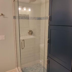 Beautiful bathroom remodel lake style! This corner shower was perfect for visiting guests at their home.