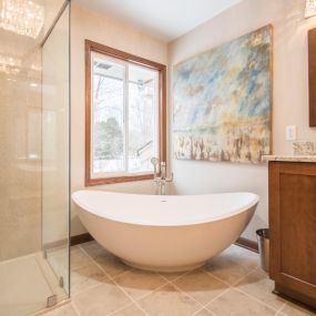 Free-standing tub look elegant in the corner of the newly remodeled bathroom