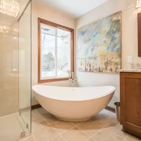 Free-standing tub look elegant in the corner of the newly remodeled bathroom