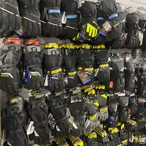 Rack of gloves for sale at Loves Park Motorsports in Roscoe, Illinois