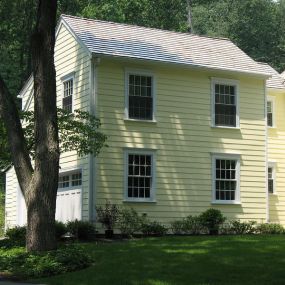 This Newtown Square salt-box colonial got a large 2 story addition. A new master suite was created on the second floor above the 2 car garage. A new breakfast room and powder room were added on the first floor and the existing kitchen was completely renovated.