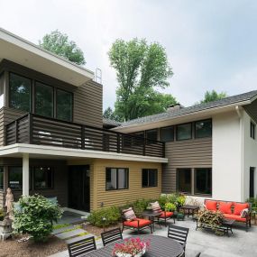 Contemporary 2 story addition and whole house remodel transformed this formerly modest 1950s two-story Wayne home.