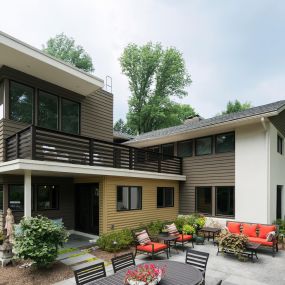 This two story ultra-contemporary addition and whole house remodel to a formerly understated Wayne home on Brookside Circle received a new kitchen and master suite. Both were added with fiberglass roof decks and a combination of Hardi siding and corrugated metal. The expansive views to the beautiful