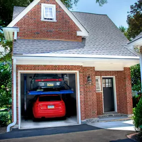 Unique double decker garage with two post car lift in Wayne, PA