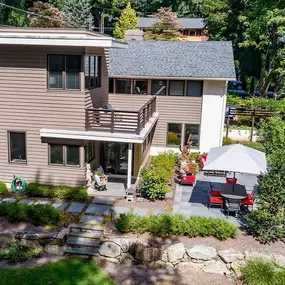 This whole house remodeling project in Wayne, PA features a brand new two story addition containing everything from an open concept kitchen, to a master suite, and living space inside and out.