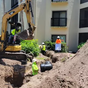 Earthwork crew digging at new project site.