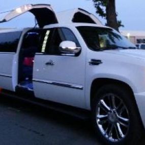 Super Limousine service.
Double Gullwing Cadillac Escalade Super Limo