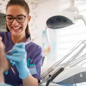 Dentist cleaning a patient's teeth