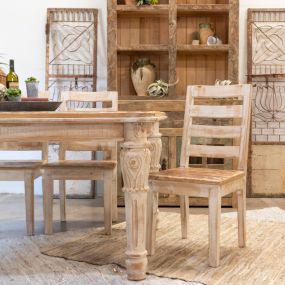 Bright and airy dining room setup with beautiful wooden pieces.