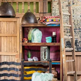 Home items that add character to a shelving unit.