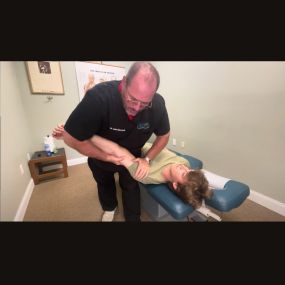Dr. John Giovanelli doing Shoulder Chiropractic Adjustment
