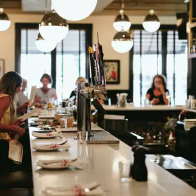 Guests at bar at Papa Razzi