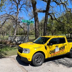 A One Hour Air Conditioning and Heating of Fort Worth service truck at the local Trinity Park in Fort Worth TX