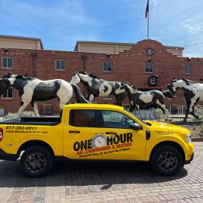 A One Hour Air Conditioning and Heating of Fort Worth service vehicle outside of The Biscuit Bar in Fort Worth TX