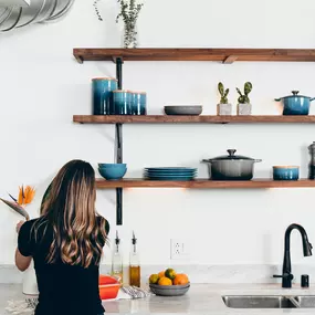 Woman enjoying new kitchen because of DDA Mortgage