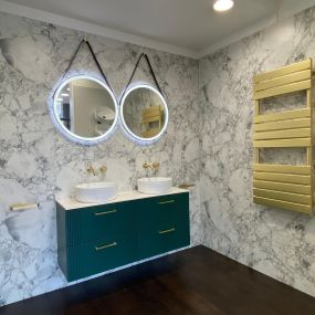 Wall hung bathroom display featuring double basin and mirror