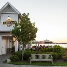 Front of building with patio and sunset in background at Boat House