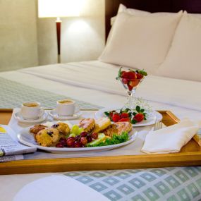 Breakfast tray on guest bed at Somerset Inn