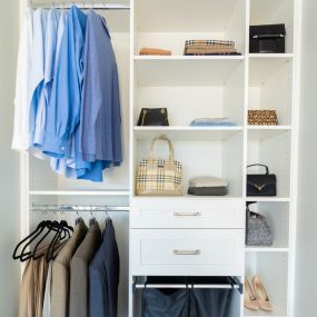 Maximize space in your reach-in closet with drawers and shelves.