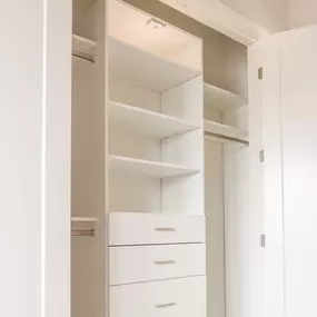 White closet. Gold hardware.