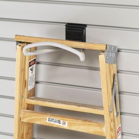 With our solutions, you can organize even the biggest items! This PVC Slatwall paired with our Loop Hook Garage Accessory is the perfect way to store ladders and step stools!