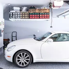 Take advantage of ceiling space with overhead storage solutions. ????⬆️ Perfect for seasonal items, sports gear, and anything you want out of the way. Ask us how to maximize your garage space!