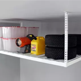 Maximize vertical space and get seasonal clutter out of the way. ????⬆️ Our overhead storage racks are perfect for totes, gear, and holiday décor. Book your free storage consultation today!