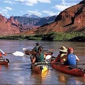 Kayaking on the Colorado River while staying at Moab Valley Inn