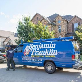 A Benjamin Franklin service vehicle and plumber on a service call near Fort Worth Texas.
