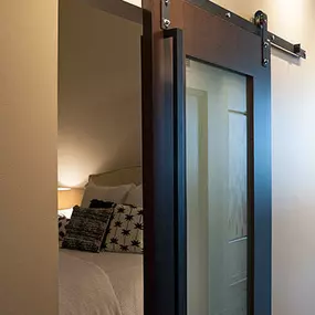 Brix Apartments Custom Barn door with Frosted Glass insert