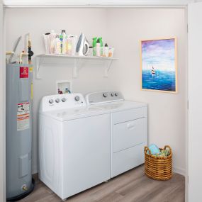 Full-size Whirlpool washer and dryer.