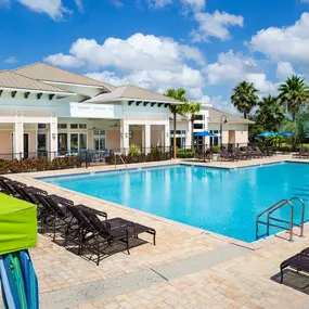 Tropical pool and veranda with outdoor seating and tv