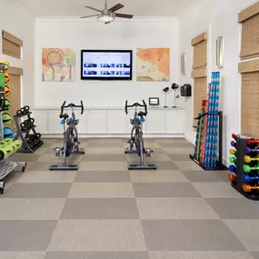 Yoga studio with spin bikes and interactive fitness at Camden LaVina apartments in Orlando, Florida.