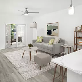 Living room with private patio at Camden LaVina apartments in Orlando, FL