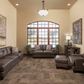 Second clubhouse lounge room with couches at Camden Riverwalk apartments in Grapevine, TX