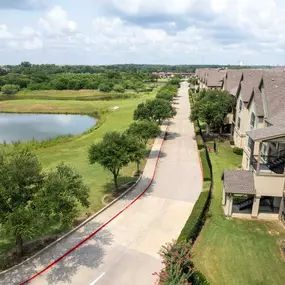 Aerial view of the community with pond and greenspace