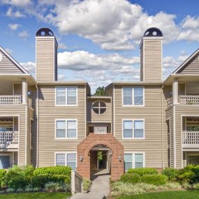 Building exterior showing private balconies and patios as well as covered staircase