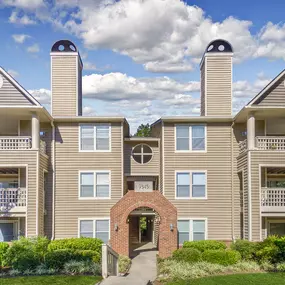 Building exterior showing private balconies and patios as well as covered staircase