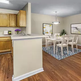 Kitchen and dining room with wood style flooring