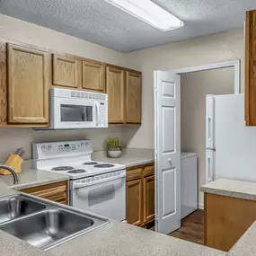 Kitchen with laundry room with full size washer and dryer