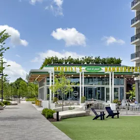 Harriet's Hamburgers restaurant and outdoor lawn at Ballantyne Bowl near Camden communities in Ballantyne, NC