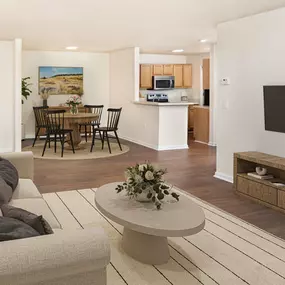 Open-concept living and dining with hardwood-style flooring at Camden Touchstone in Charlotte, NC