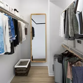 Camden San Marcos Apartments Scottsdale AZ walk-in closet with woodlike flooring, wooden shelves and rods