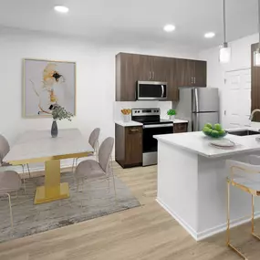 Camden San Marcos Apartments Scottsdale AZ open concept dining area with woodlike flooring near kitchen with stainless steel appliances and white quartz countertop with space for barstool seating