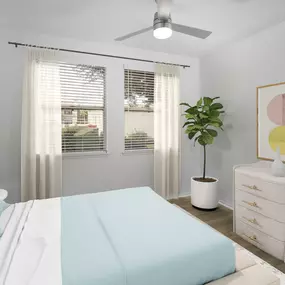 Camden San Marcos Apartments Scottsdale AZ Main Bedroom with two windows, woodlike flooring, and lighted ceiling fan