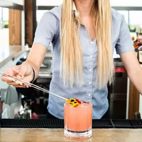 Bartender creating speciality cocktail